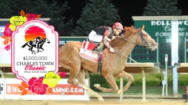 Jockey on a horse with track background