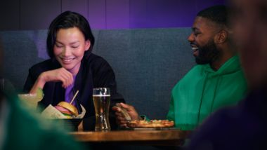 Couple eating in ESPN BET
