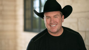 Rodney Carrington in a black cowboy hat and black shirt.