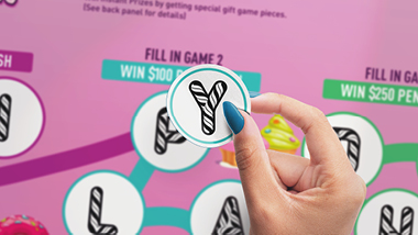 Person with blue fingernails holding a candy cash sticker with candy cash background