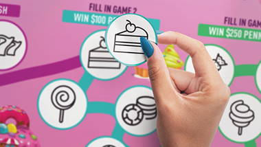 Hand placing Candy Cash Game Sticker