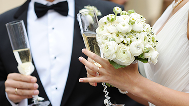 Wedding couple bride groom with bouquet rings and champagne flutes