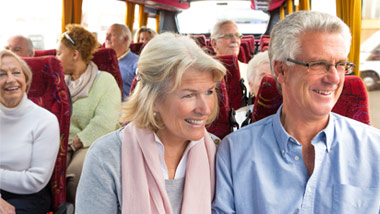 older couple on a bus trip