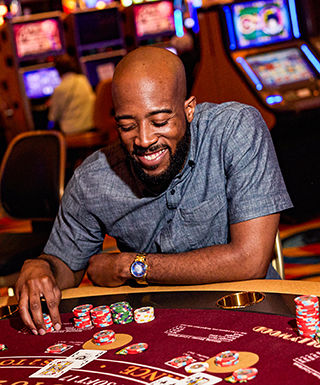 Guy playing cards at a casino